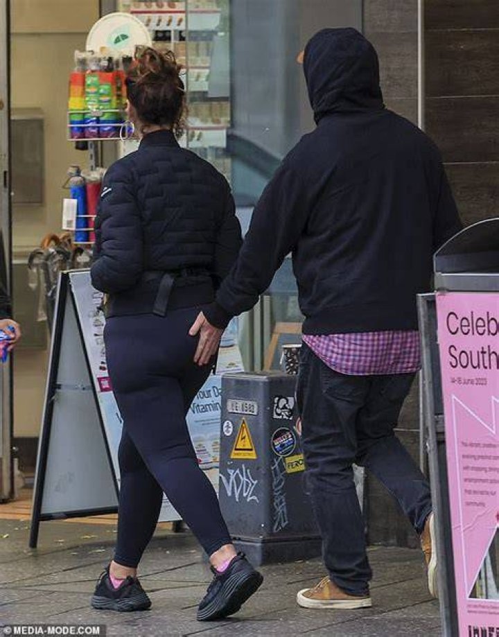 Cheeky! The pair looked in great spirits as they had a quick kiss before driving back to their hotel